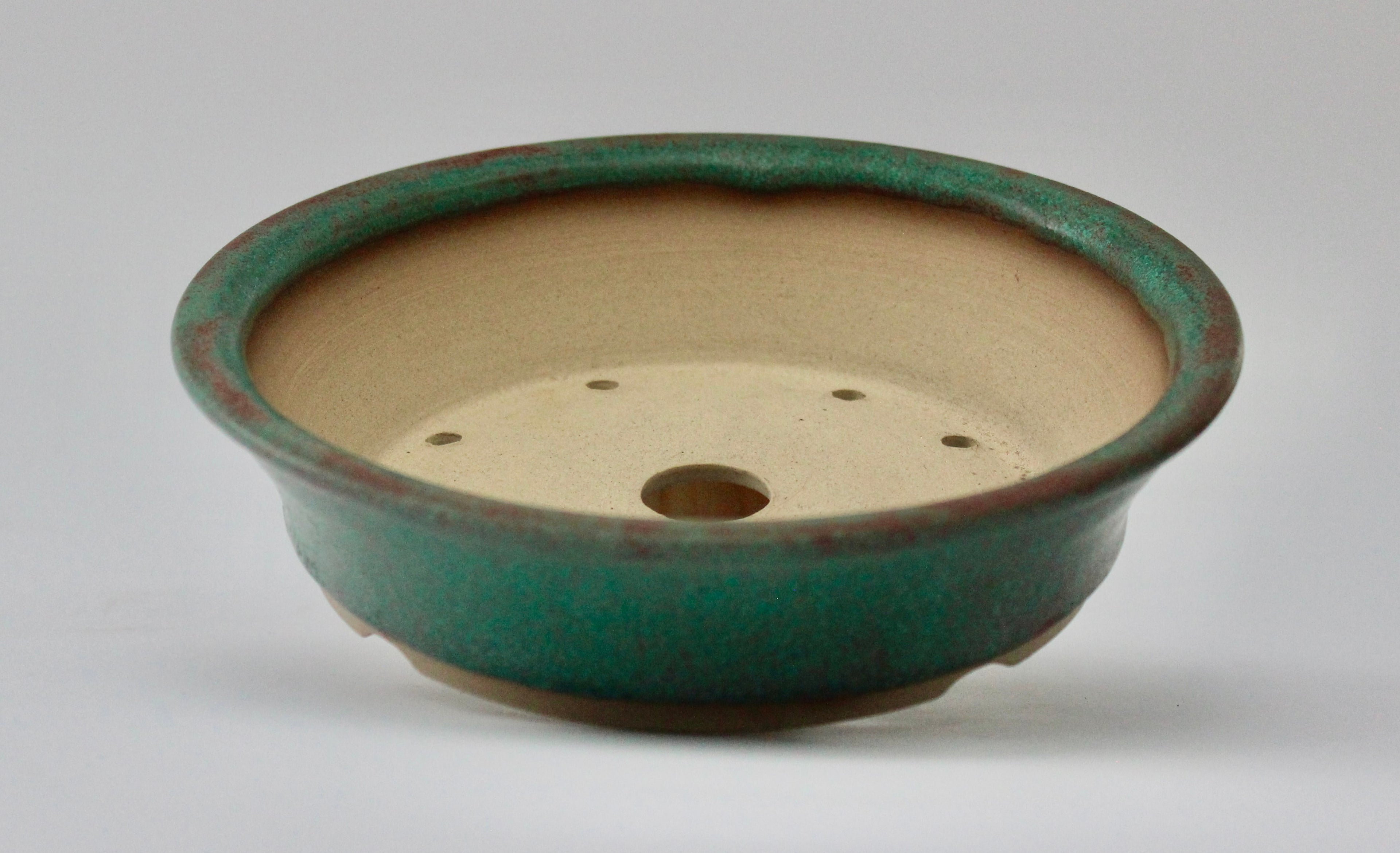 Round bonsai pot in a matte copper glaze. D.171mm