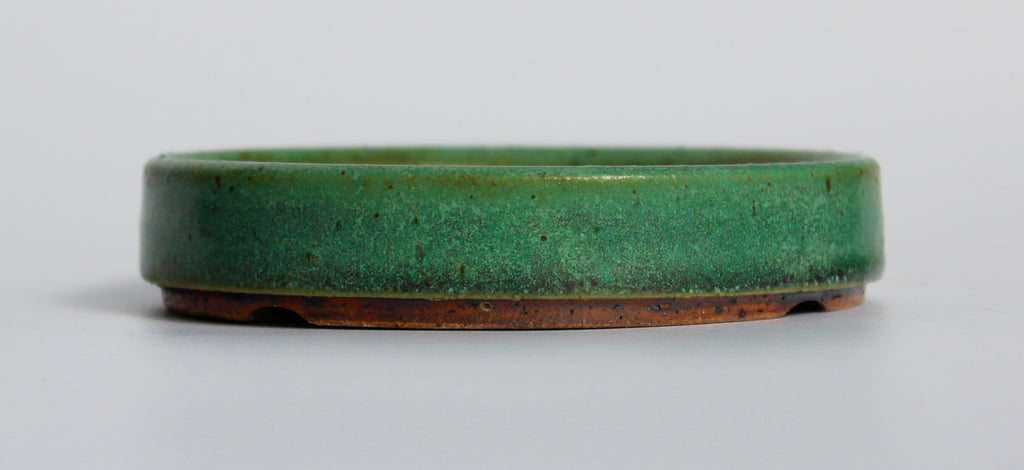 Round bonsai pot in a matte green glaze. D.127mm
