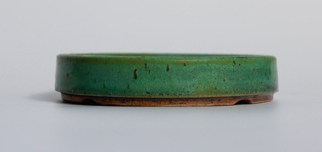 Round bonsai pot in a matte green glaze. D.127mm