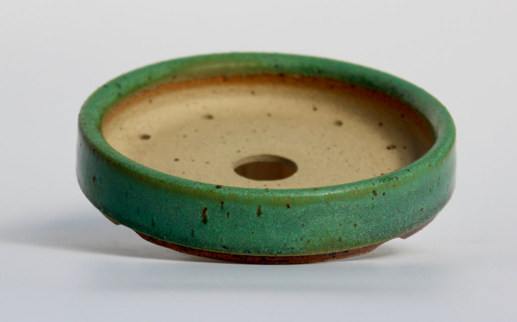 Round bonsai pot in a matte green glaze. D.127mm