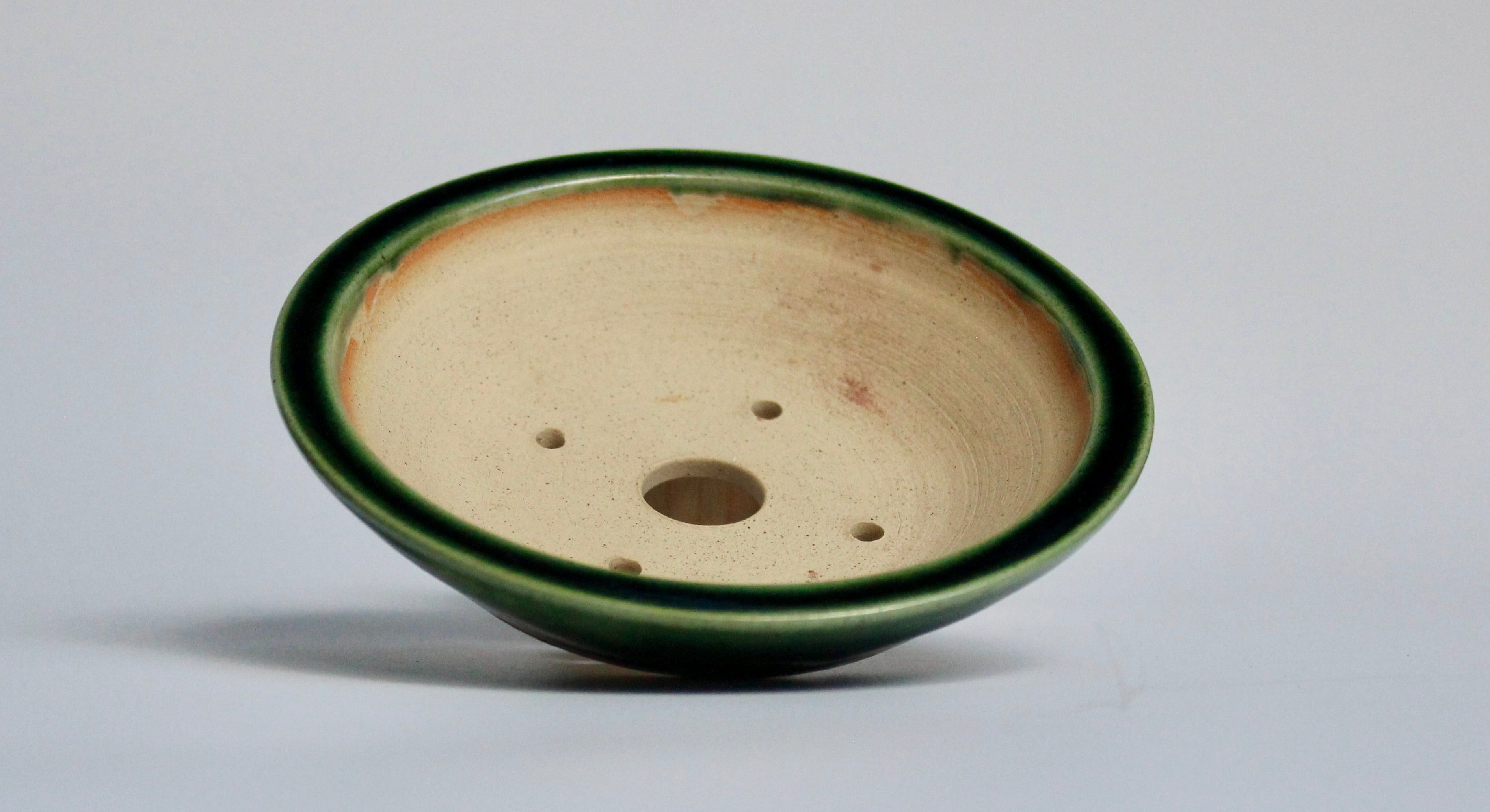 Round bonsai pot in a green oribe glaze 121mm