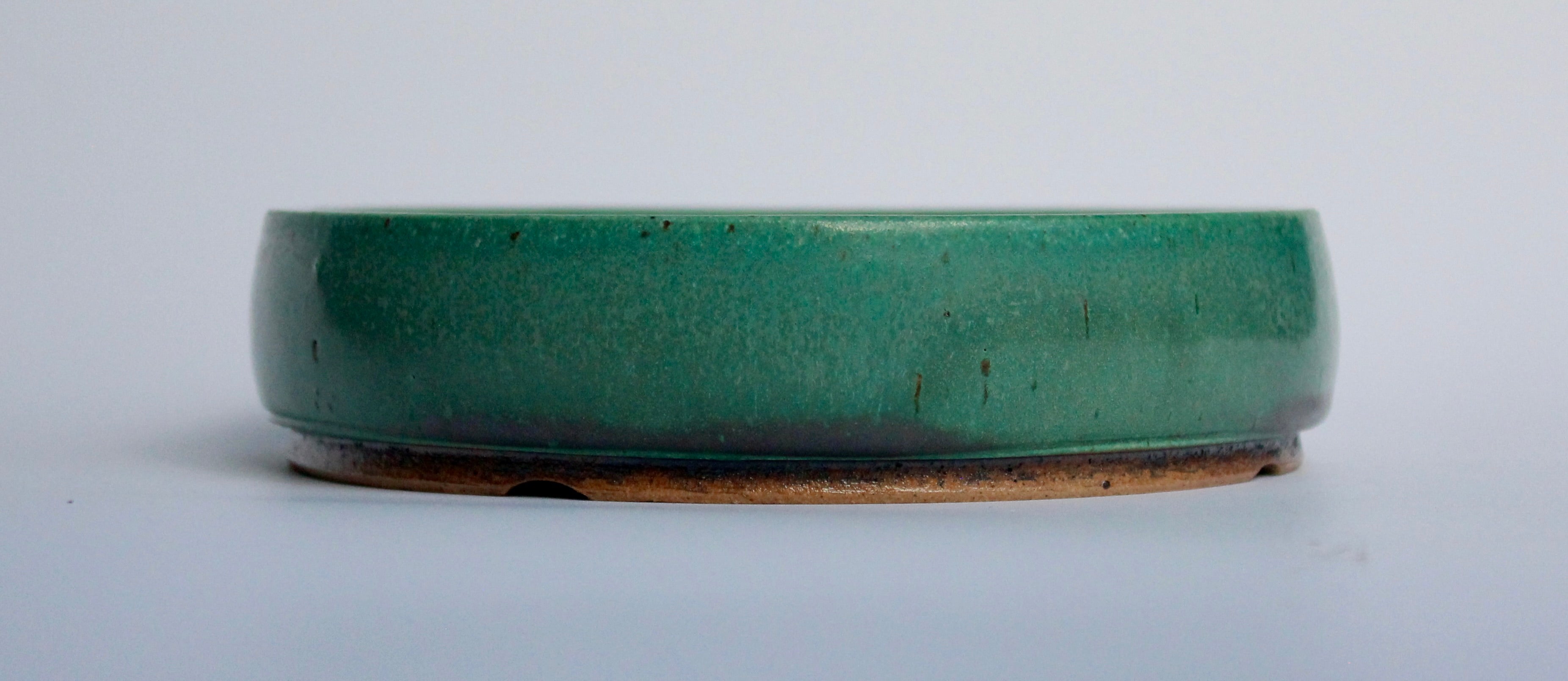 Round bonsai pot in a matte green glaze. D.163mm