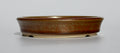 Round bonsai pot in a copper brown/orange glaze. D.133mm