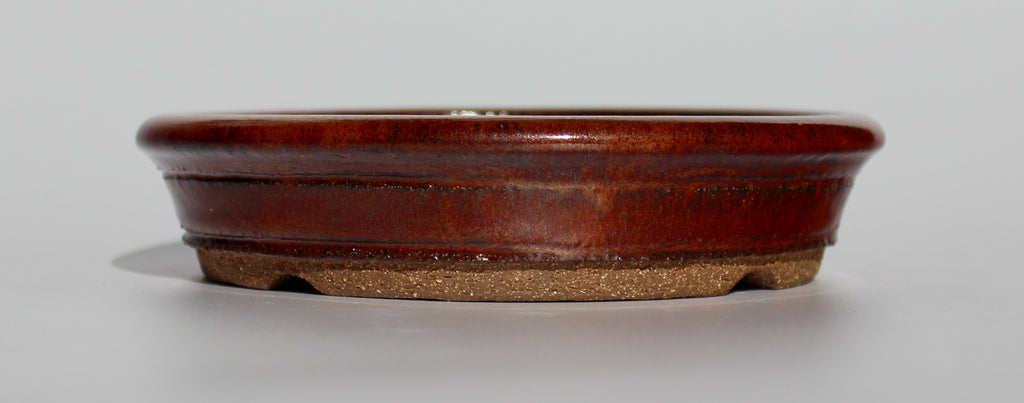 Round bonsai pot in an iron red glaze. D.163mm