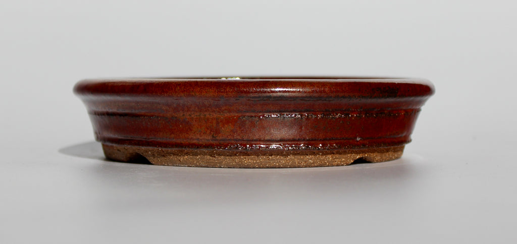 Round bonsai pot in an iron red glaze. D.163mm