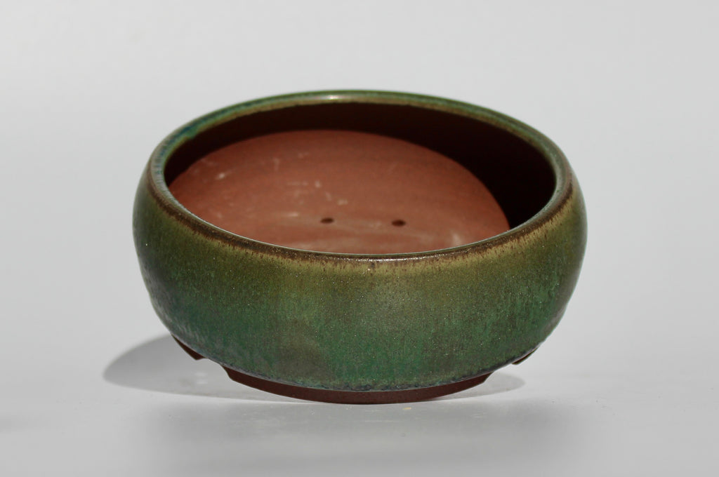 Round bonsai pot in a dark green copper glaze. D.130mm