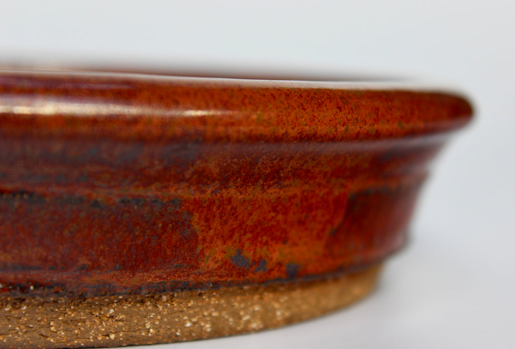 Round bonsai pot in an iron red glaze. D.163mm