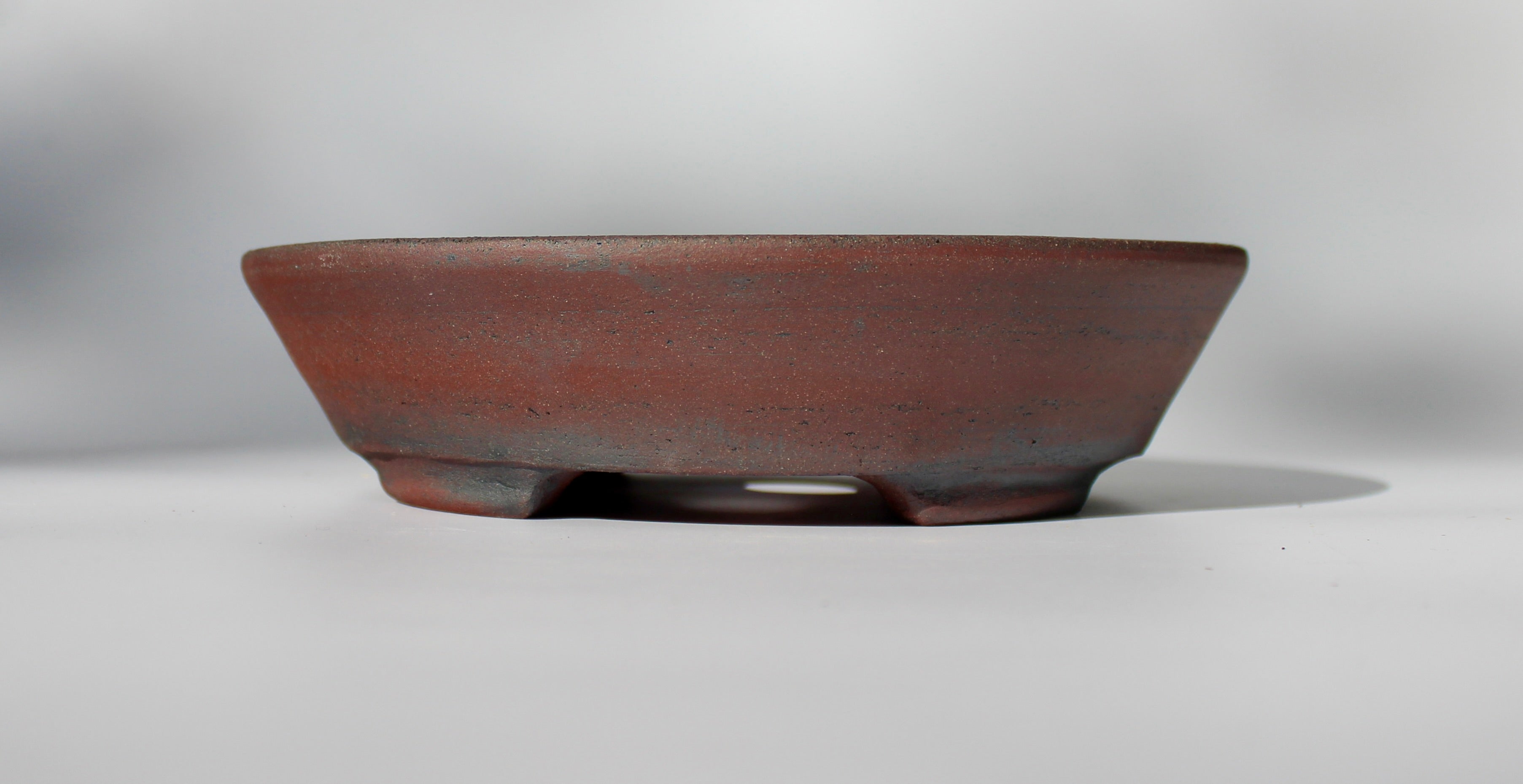 Round bonsai pot - unglazed in a red stoneware clay. D.211mm