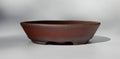Round bonsai pot - unglazed in a red stoneware clay. D.211mm