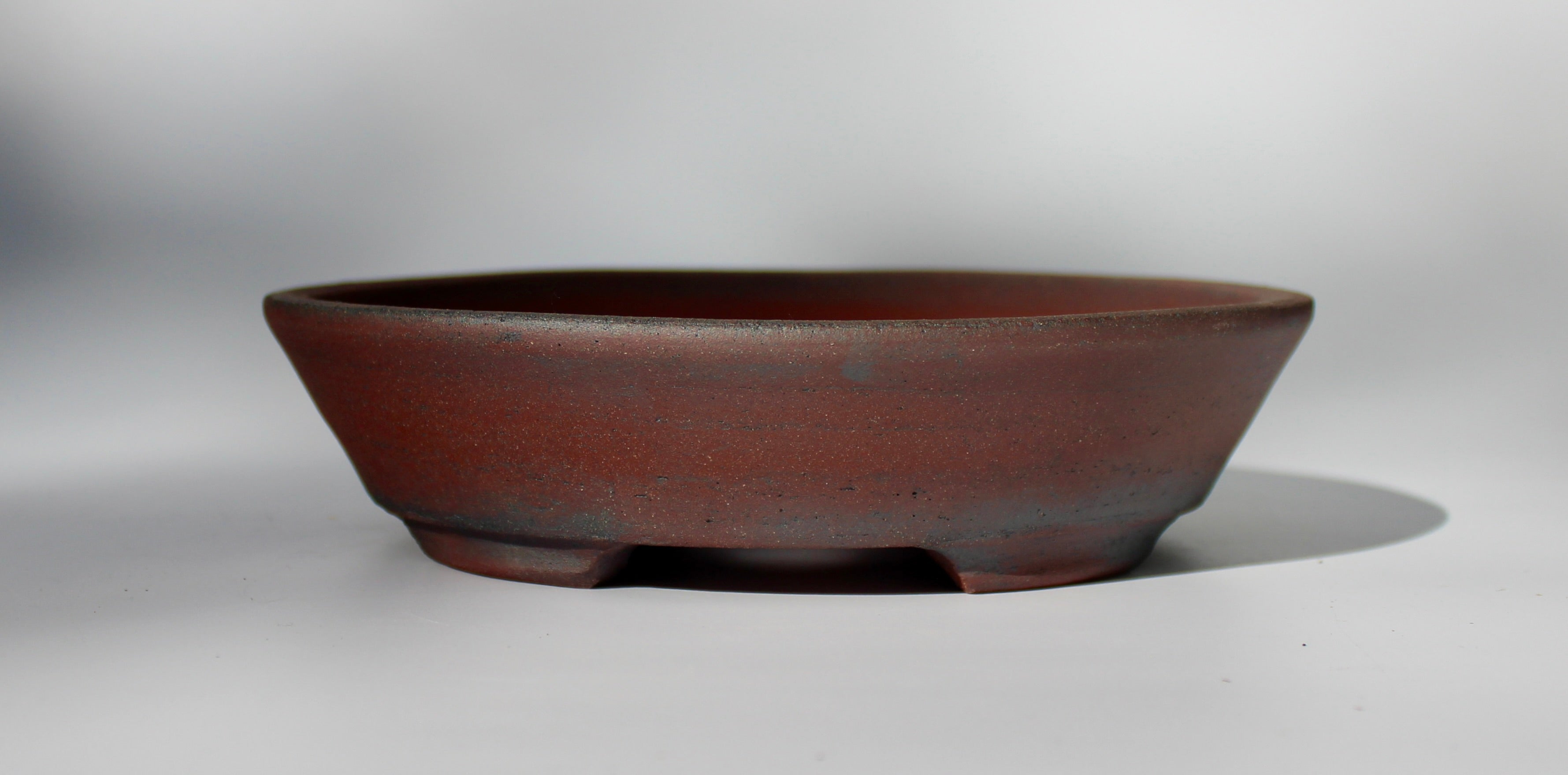 Round bonsai pot - unglazed in a red stoneware clay. D.211mm