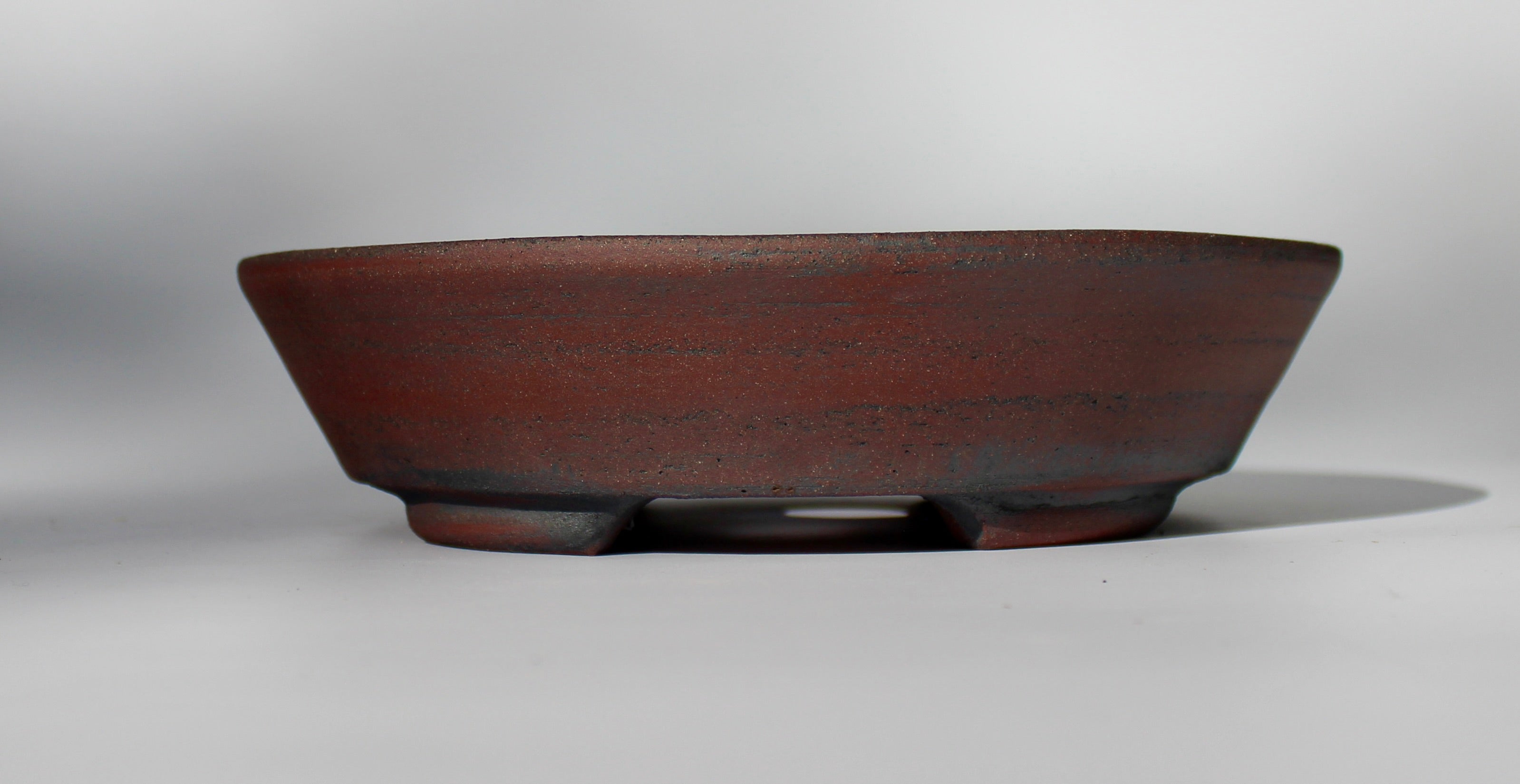Round bonsai pot - unglazed in a red stoneware clay. D.211mm