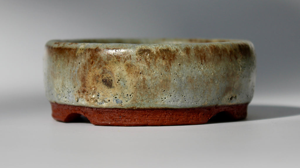 Round bonsai pot in a matte green glaze. D.80mm