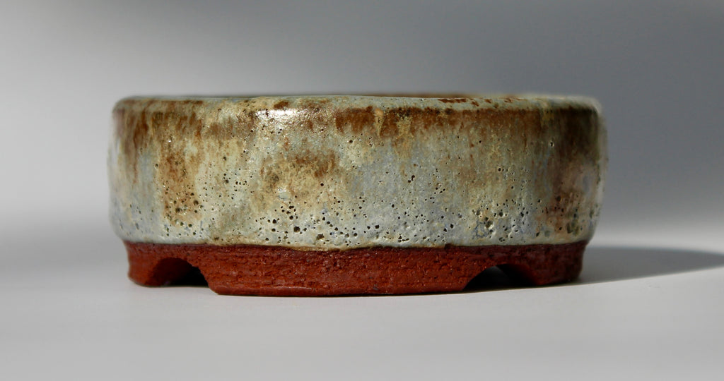 Round bonsai pot in a matte green glaze. D.80mm