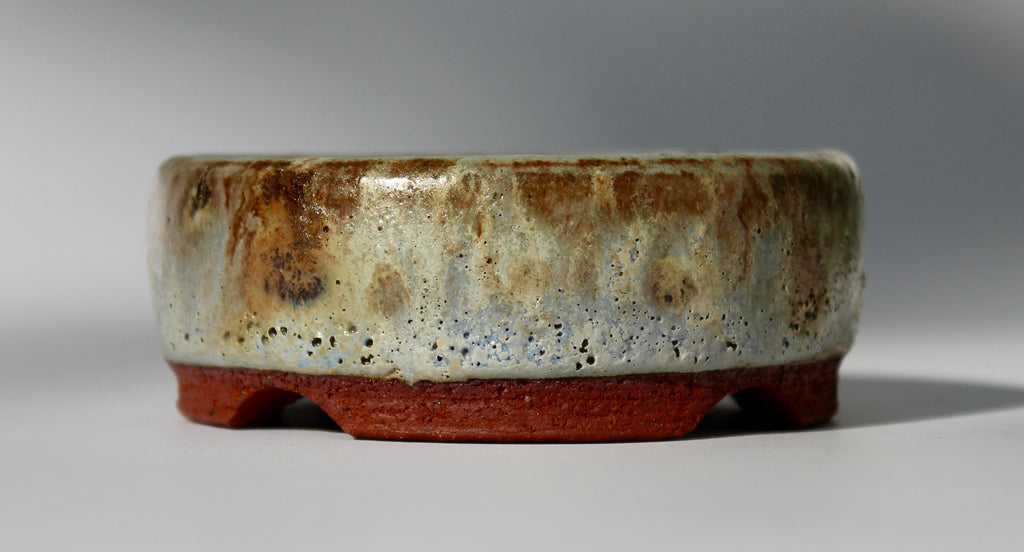 Round bonsai pot in a matte green glaze. D.80mm