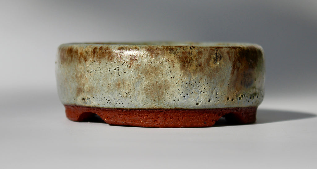 Round bonsai pot in a matte green glaze. D.80mm