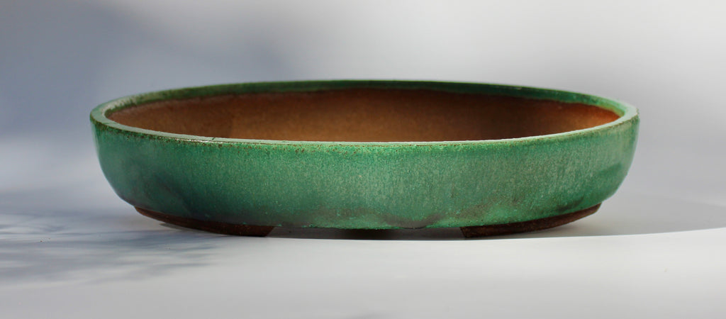Oval bonsai pot in a matte copper green glaze 324x232mm