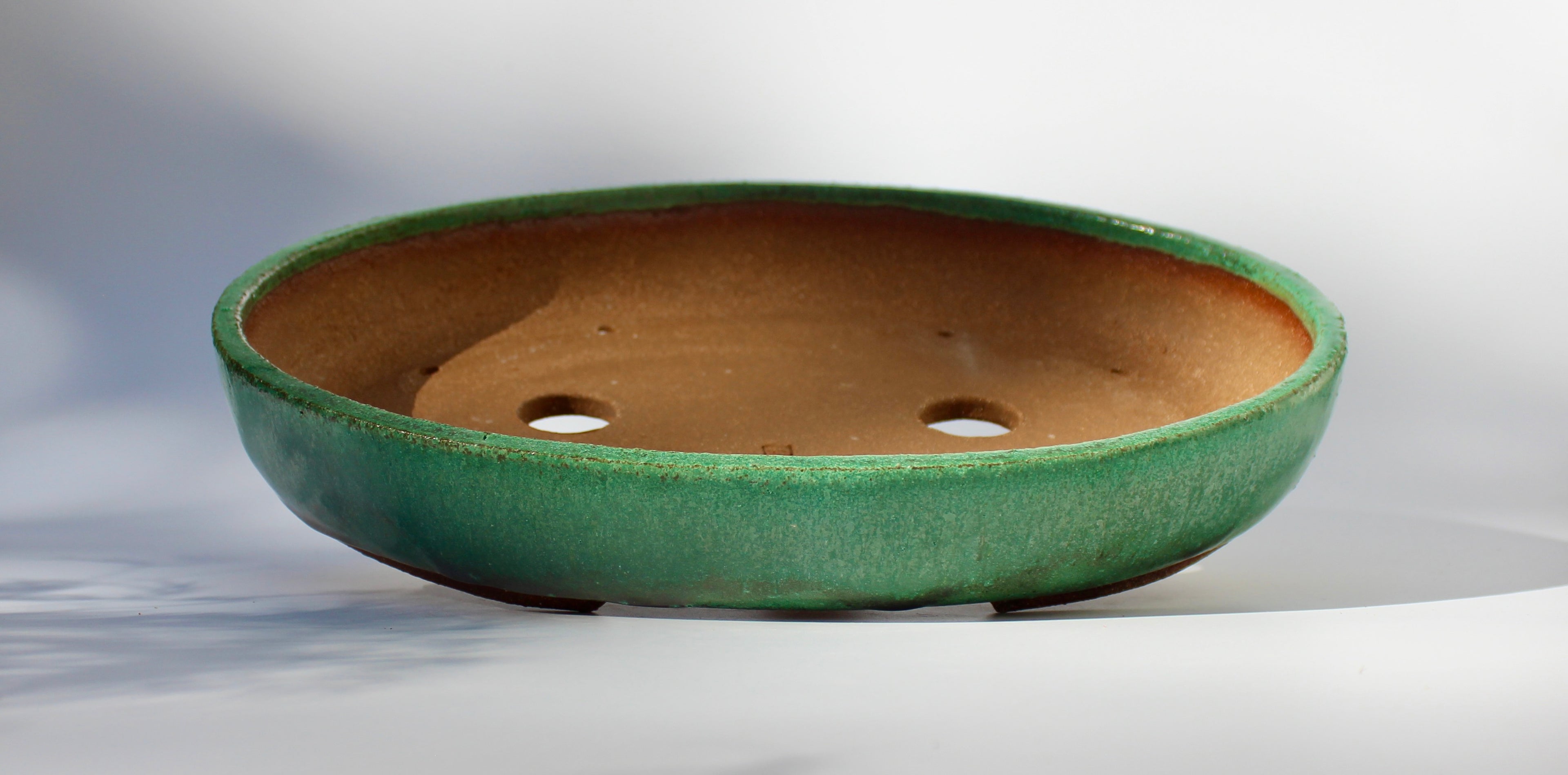 Oval bonsai pot in a matte copper green glaze 324x232mm