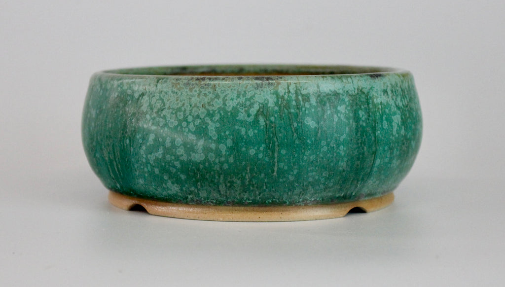 Round bonsai pot in a matte green glaze. D.150mm