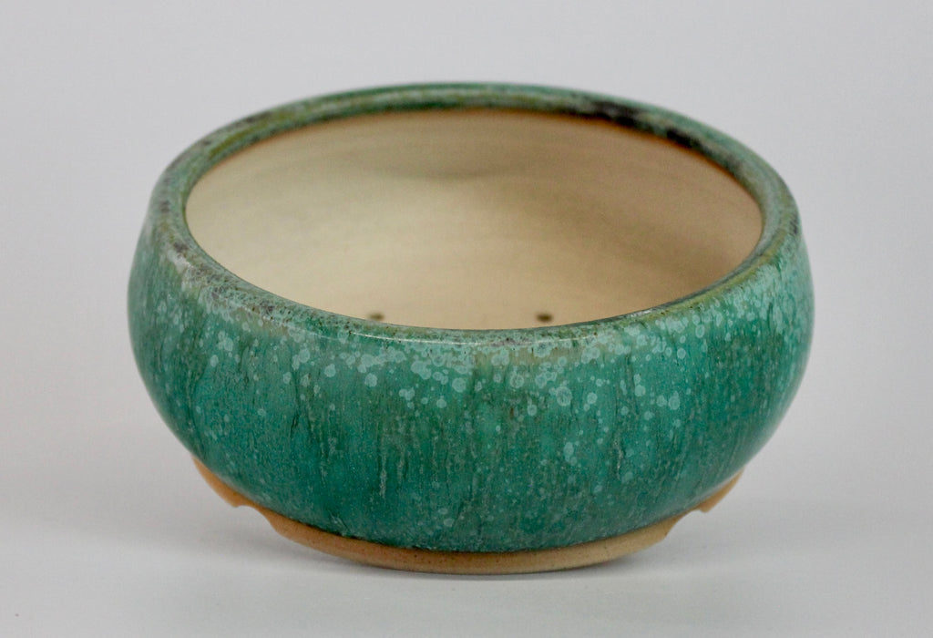 Round bonsai pot in a matte green glaze. D.150mm