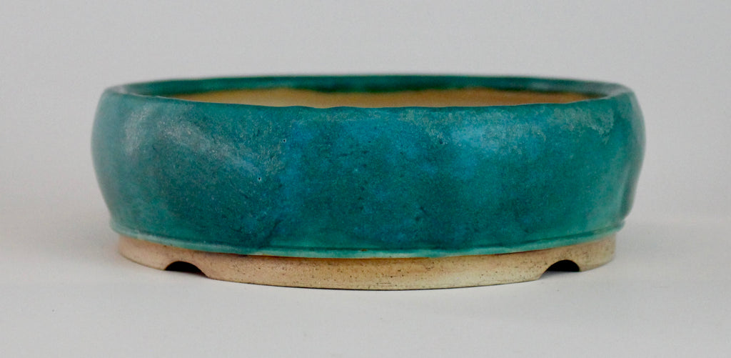 Round bonsai pot in a matte blue glaze. D.127mm